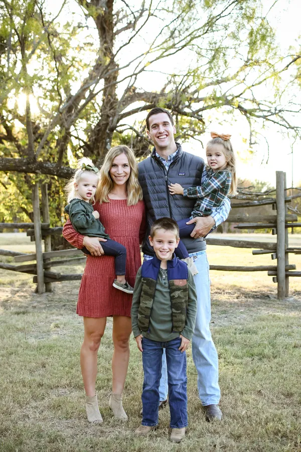 Dr. Hudson Standing in front of Practice and Smiling Warmly